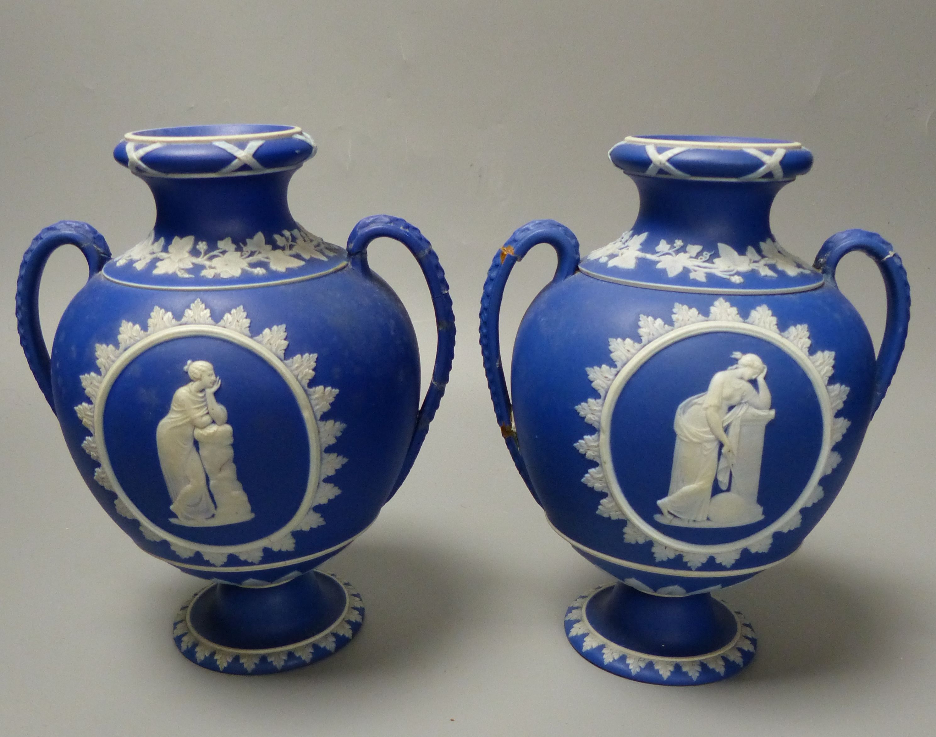 Four pieces of Wedgwood jasper wares including a pair of Victorian blue jasper vases, height 18.5cm, and later dish and pin dish